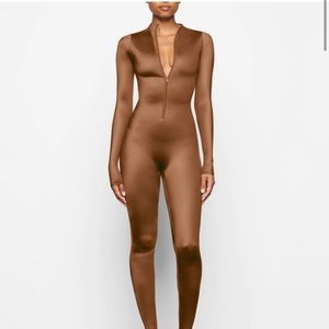 SKIMS ALL-IN-ONE SHINE MOCK NECK LONG SLEEVE ONESIE